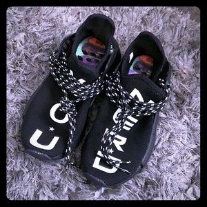 Human racer Pharrell all black